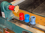 2 inch squishy lathe sanders in red, blue and gray with a scalloped disc mounted on the lathe