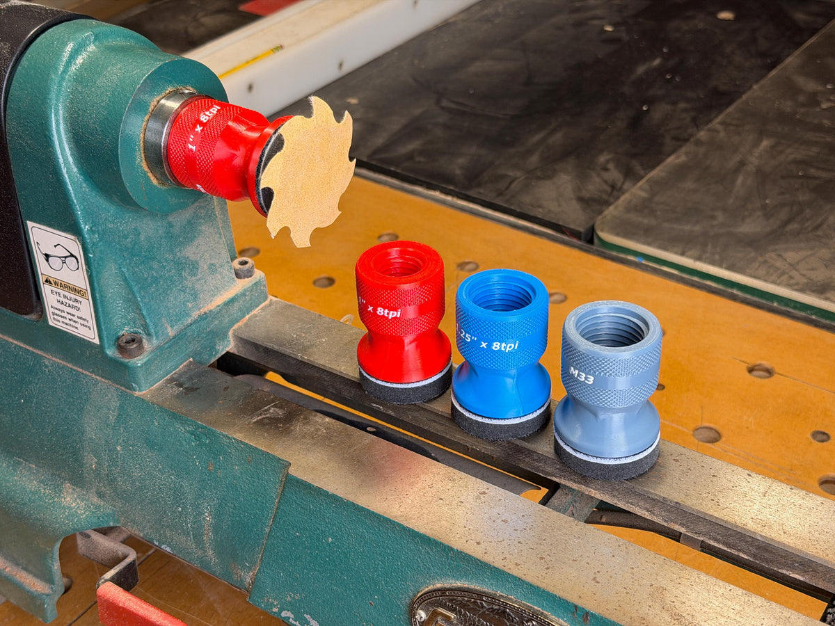2 inch squishy lathe sanders in red, blue and gray with a scalloped disc mounted on the lathe