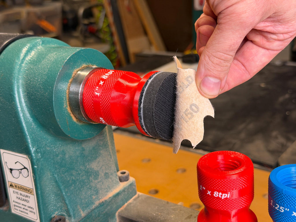 Peeling a 2 inch hook and loop disc off the squishy pad